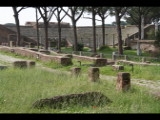 01885 ostia - regio ii - insula vii - piazzale delle corporazioni (ii,vii,4) - hintergrund theater.jpg